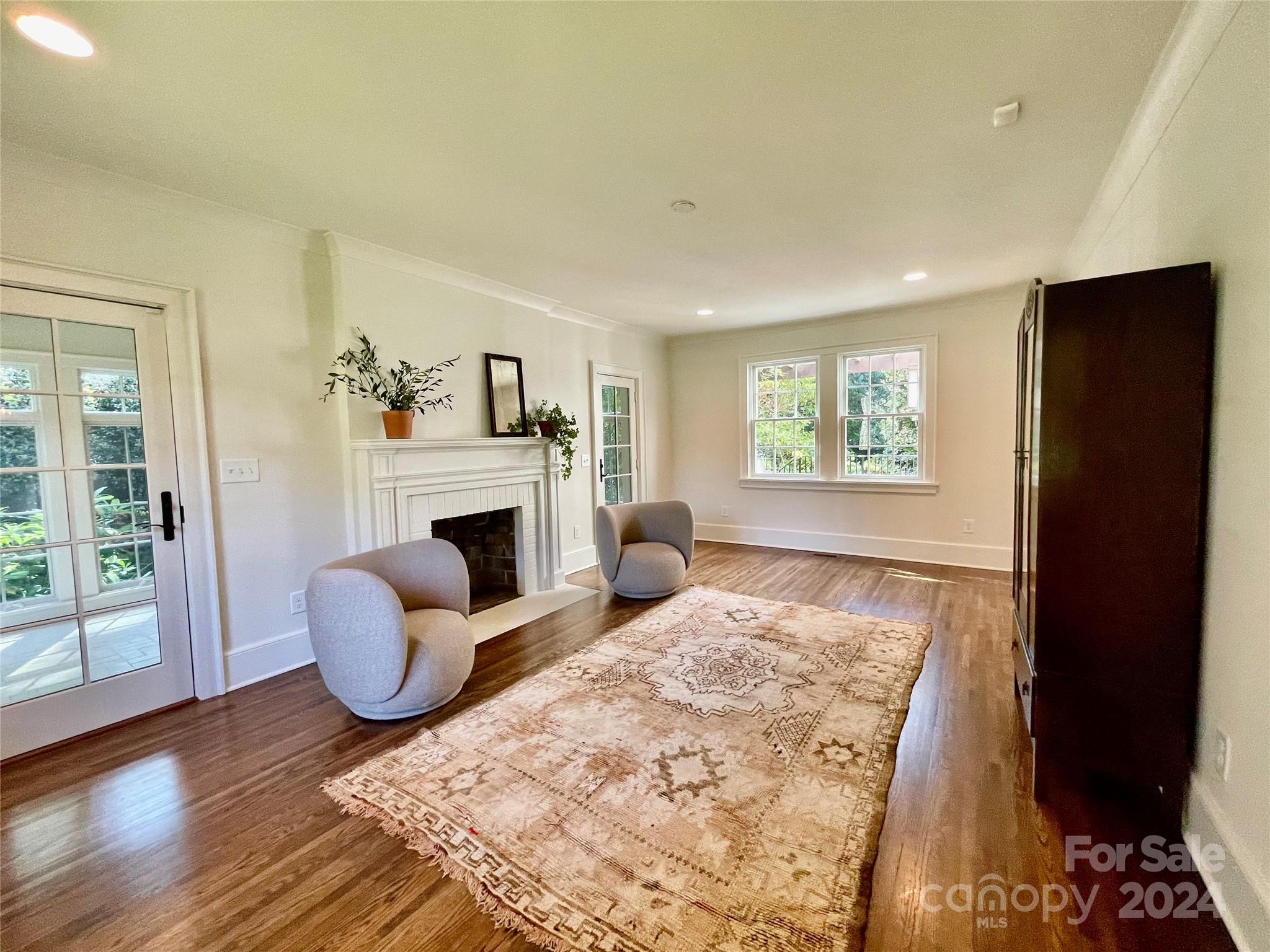 526 Lorimer Road Davidson, NC 28036 - Photo 9 of 41 a living room with furniture and a fireplace