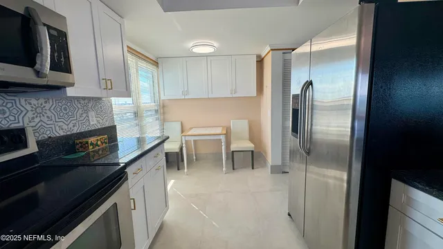 a kitchen with a stove and a microwave