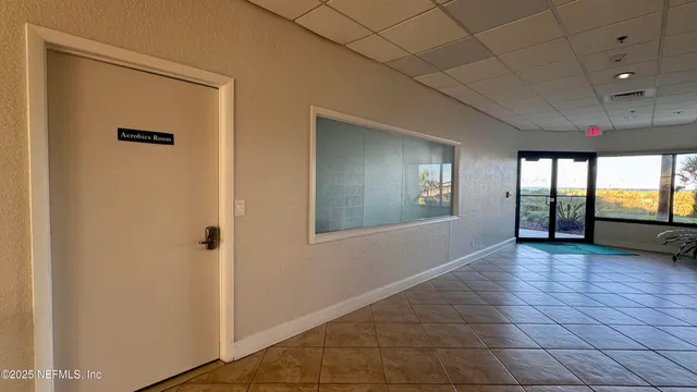 a view of livingroom with an empty space and window