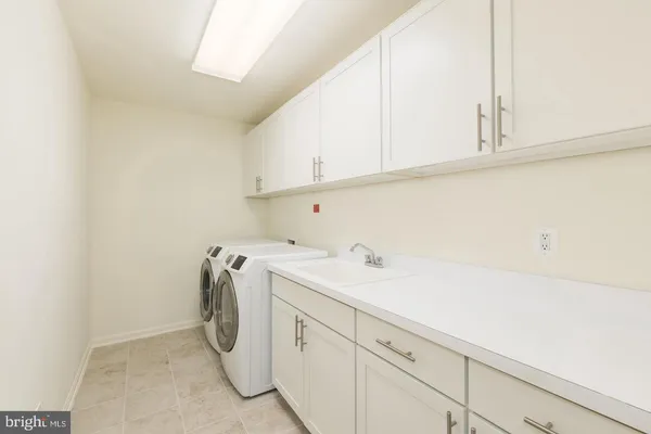 a bathroom with a shower sink vanity and mirror