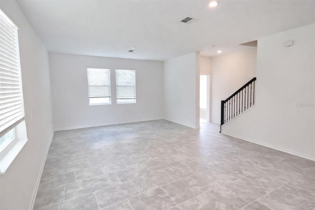 4129 Conjunction Way Apopka, FL 32712 - Photo 2 of 9 a view of an empty room with a window
