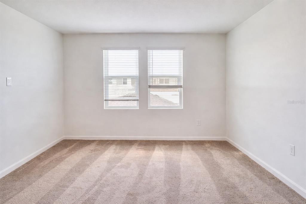 4129 Conjunction Way Apopka, FL 32712 - Photo 5 of 9 an empty room with a window