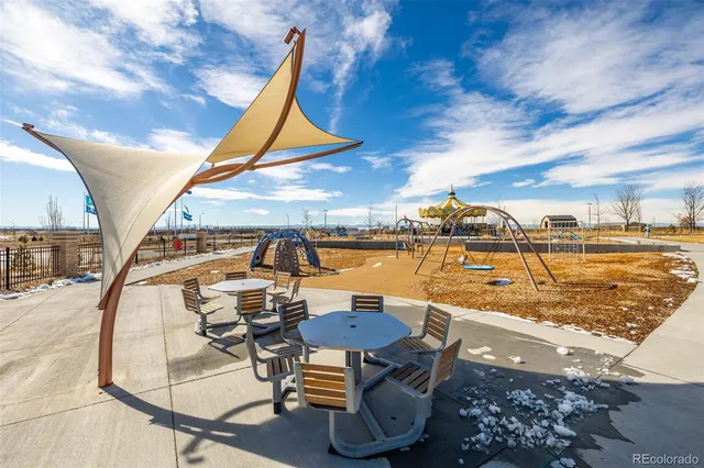 a view of a swimming pool with an outdoor seating