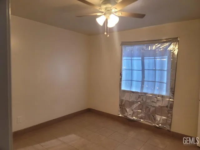 an empty room with a empty space and a window