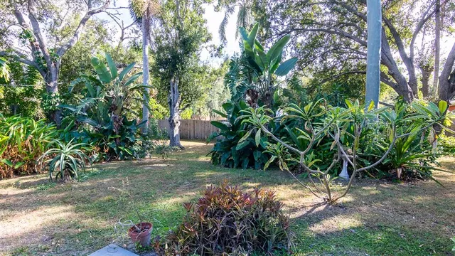 a backyard of a house with lots of green space