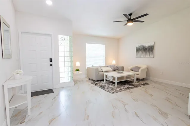 a living room with furniture and a window