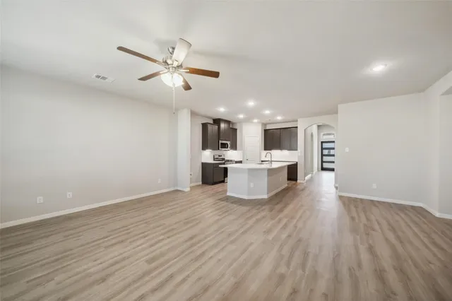 a view of kitchen with wooden floor and window