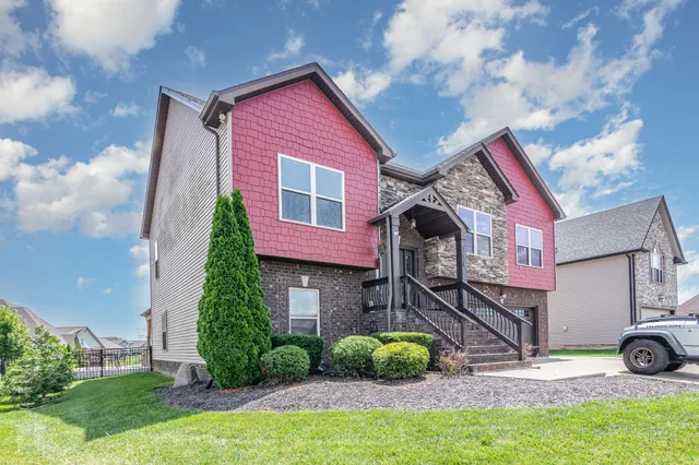 a front view of a house with garden