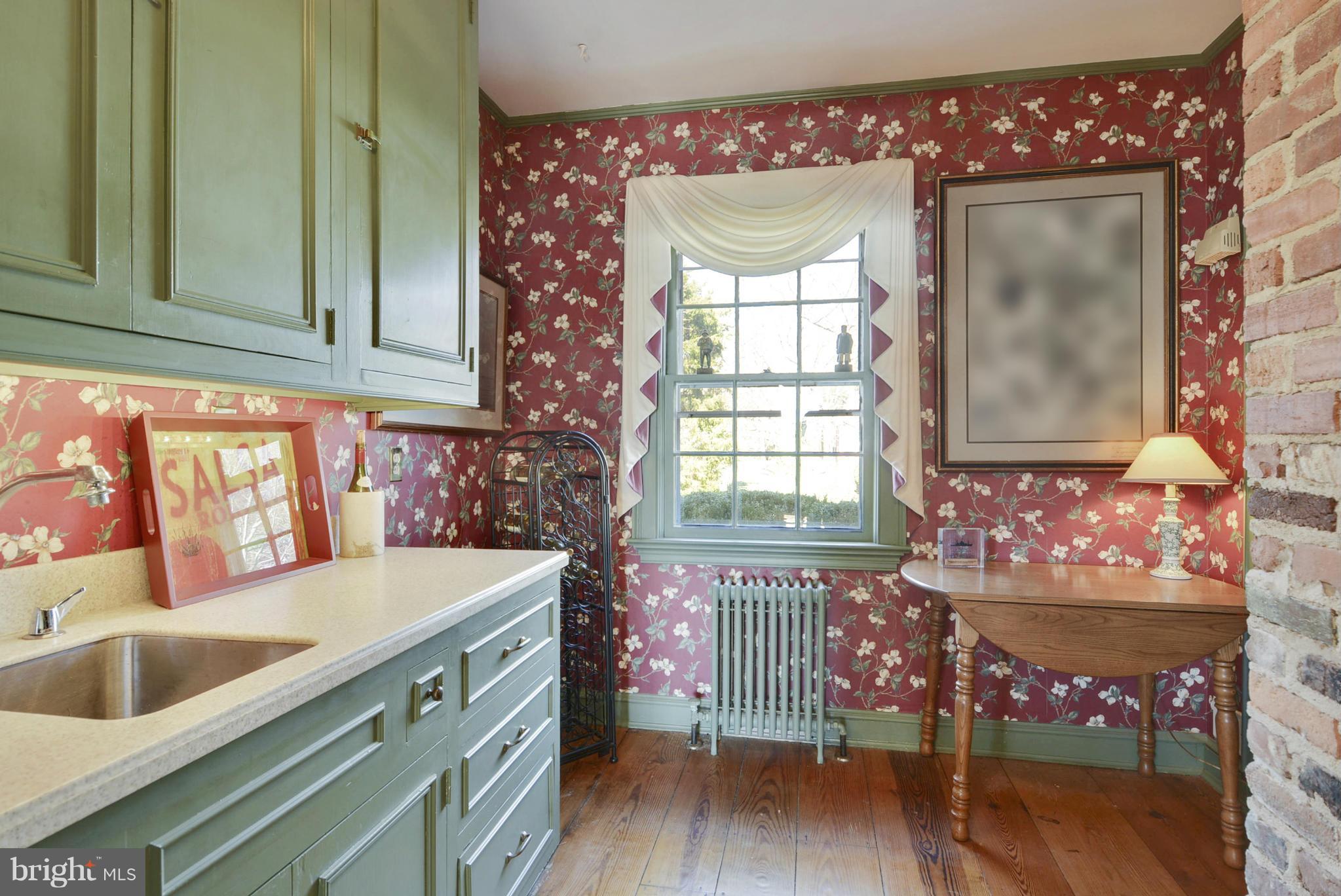 7310 Solitude Road St. Michaels, MD 21663 - Photo 14 of 30 a kitchen that has a sink and a stove