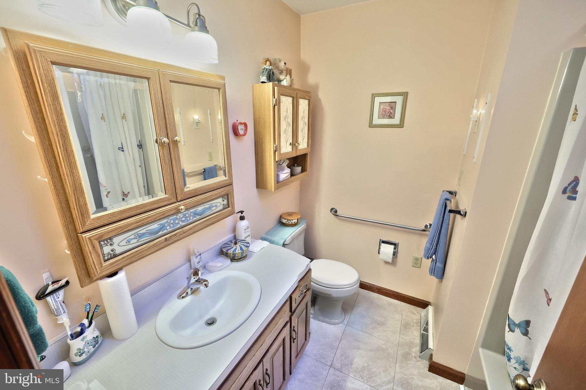 244 Miller Road Akron, PA 17501 - Photo 17 of 34 Charming bathroom with warm, inviting tones.