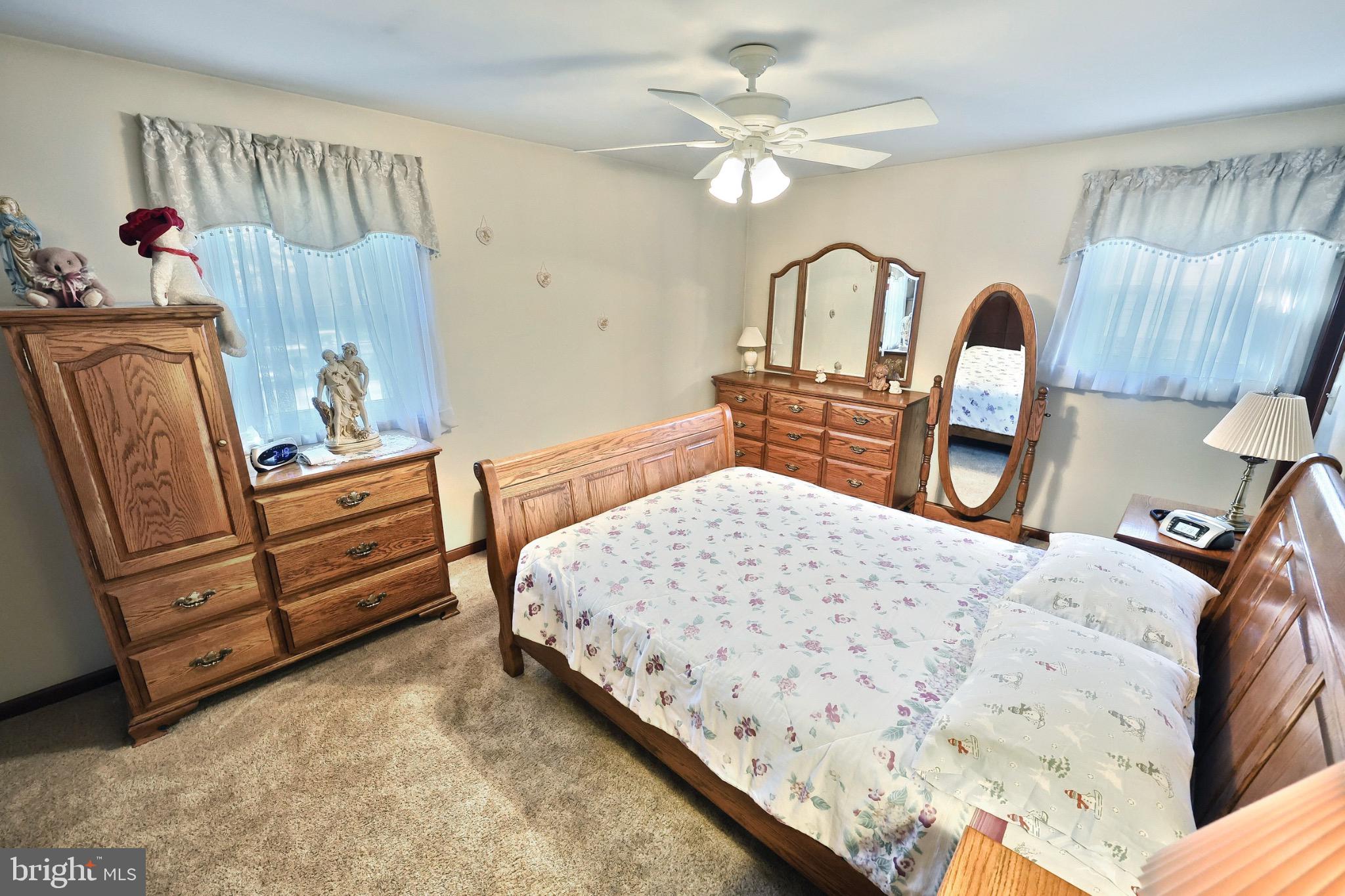 244 Miller Road Akron, PA 17501 - Photo 19 of 34 Cozy bedroom with warm wooden accents.