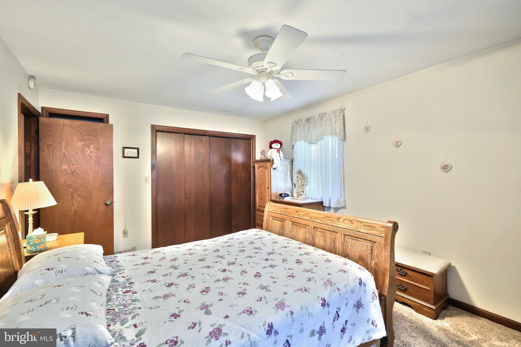 244 Miller Road Akron, PA 17501 - Photo 20 of 34 Cozy bedroom with warm, inviting tones.