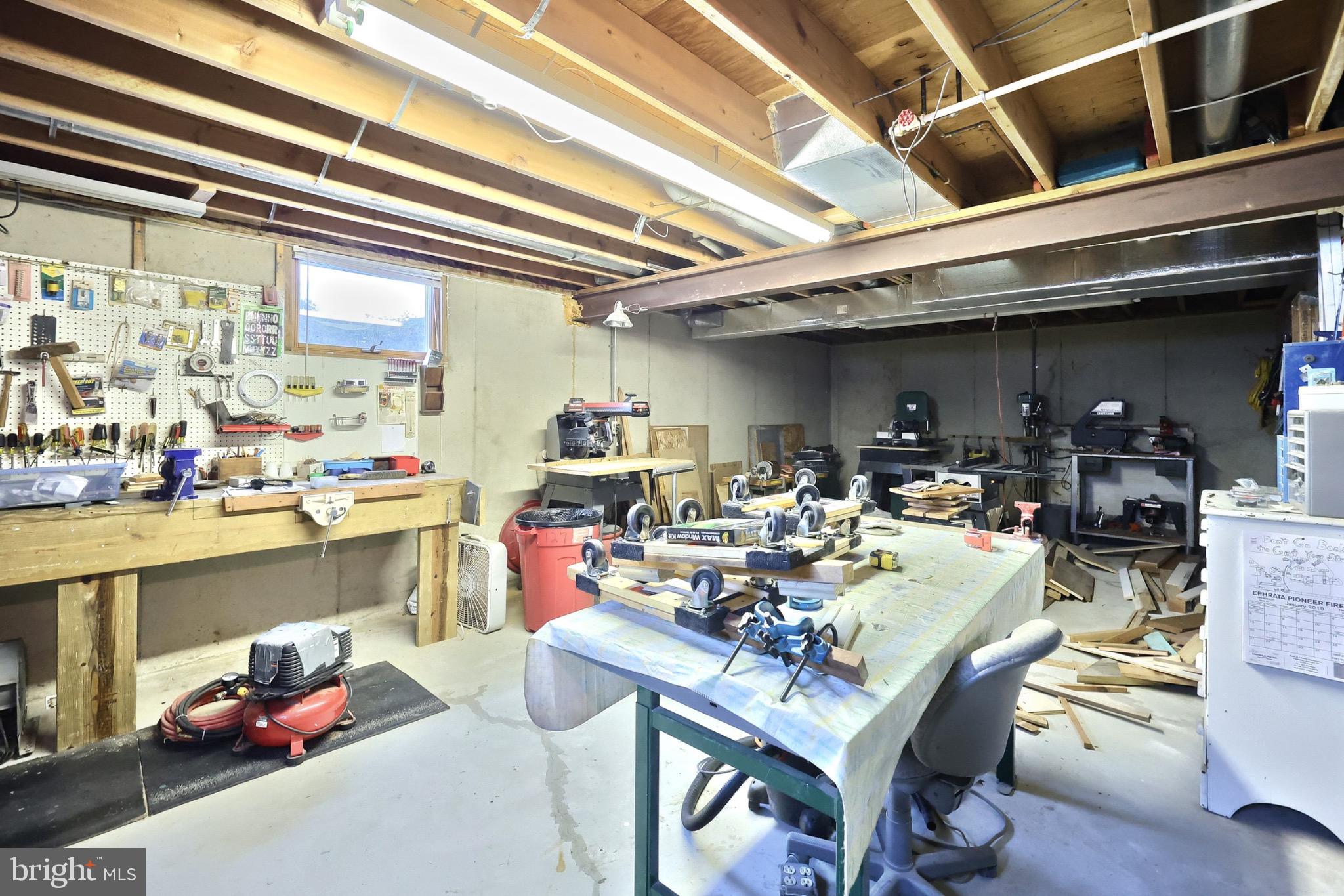 244 Miller Road Akron, PA 17501 - Photo 25 of 34 Spacious workshop with ample tools and light.