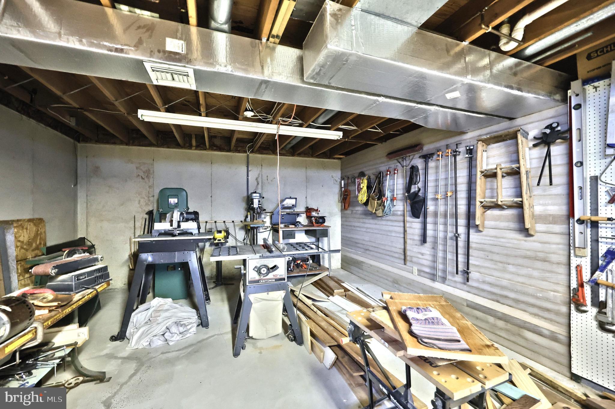 244 Miller Road Akron, PA 17501 - Photo 26 of 34 Craftsman's haven: tools and creativity unite.