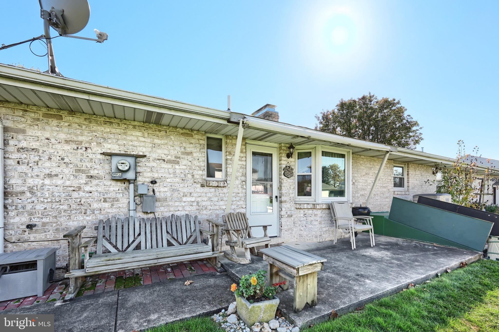 244 Miller Road Akron, PA 17501 - Photo 33 of 34 Charming patio with sunlit serenity.