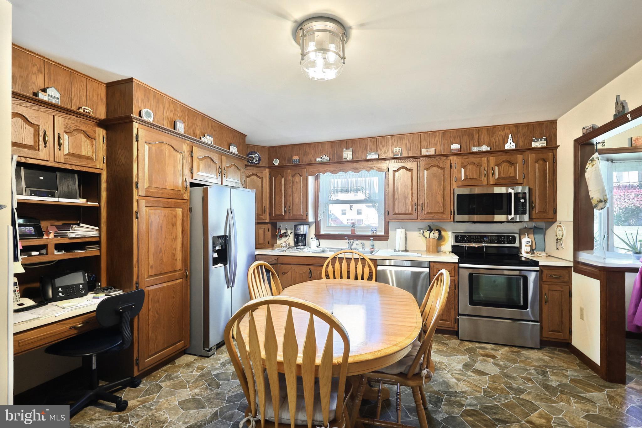 244 Miller Road Akron, PA 17501 - Photo 7 of 34 Warm wooden kitchen with modern appliances.