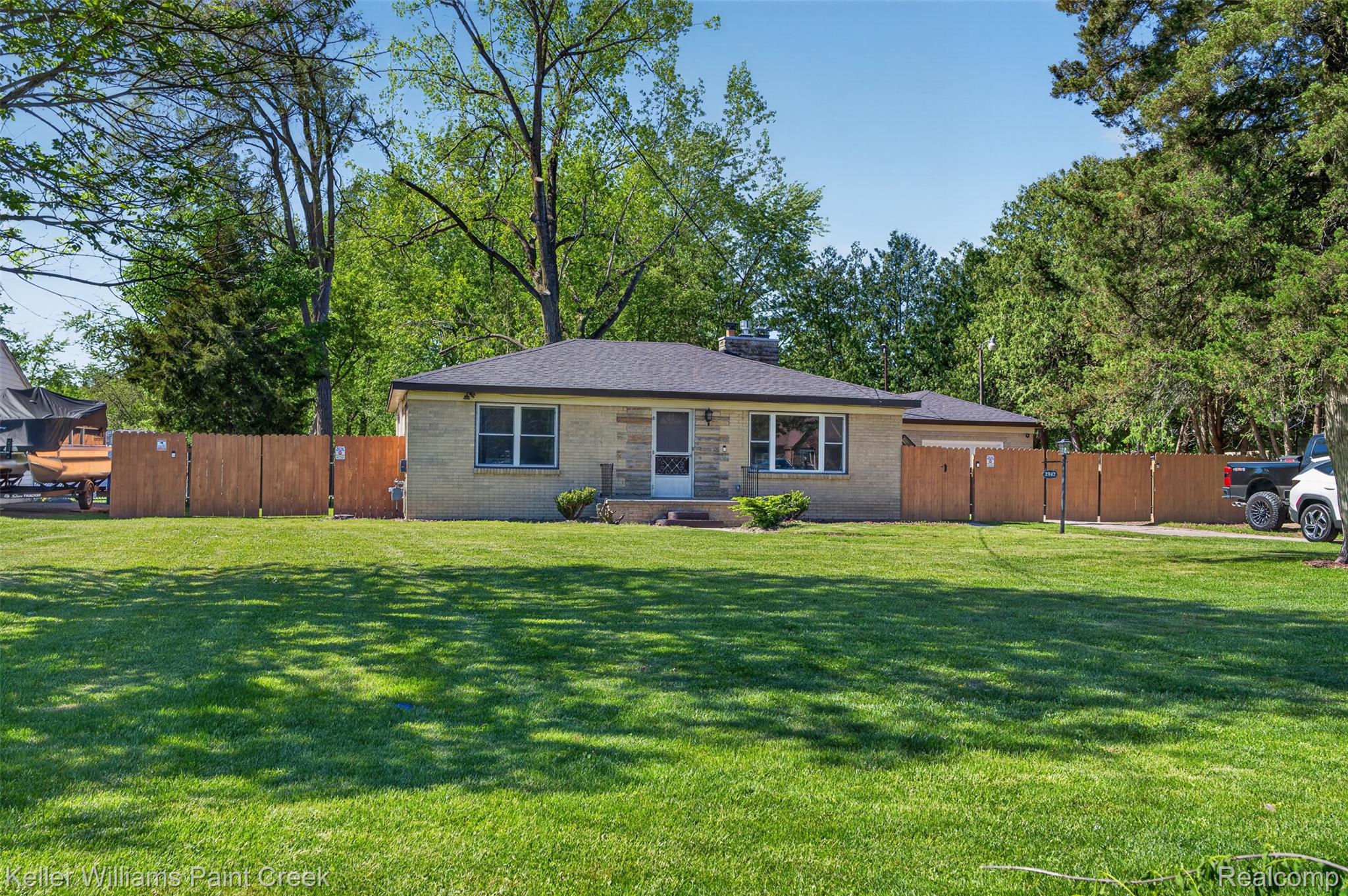 2942 Tatham Road Saginaw, MI 48601 - Photo 43 of 59 View of front of property with a chimney and brick siding
