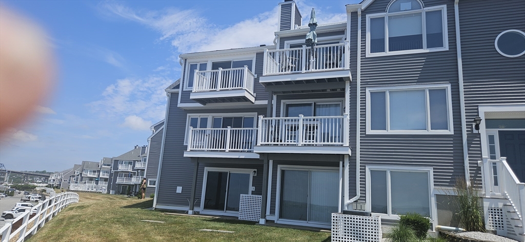 a view of front of house with a yard