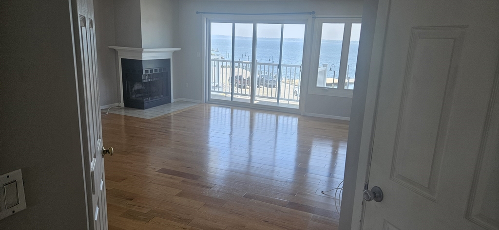 700 Shore Drive, Unit 513 Fall River, MA 02721 - Photo 7 of 12 a view of hallway with wooden floor