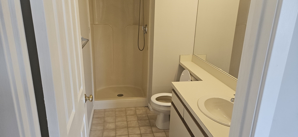 700 Shore Drive, Unit 513 Fall River, MA 02721 - Photo 9 of 12 a bathroom with a sink and a mirror