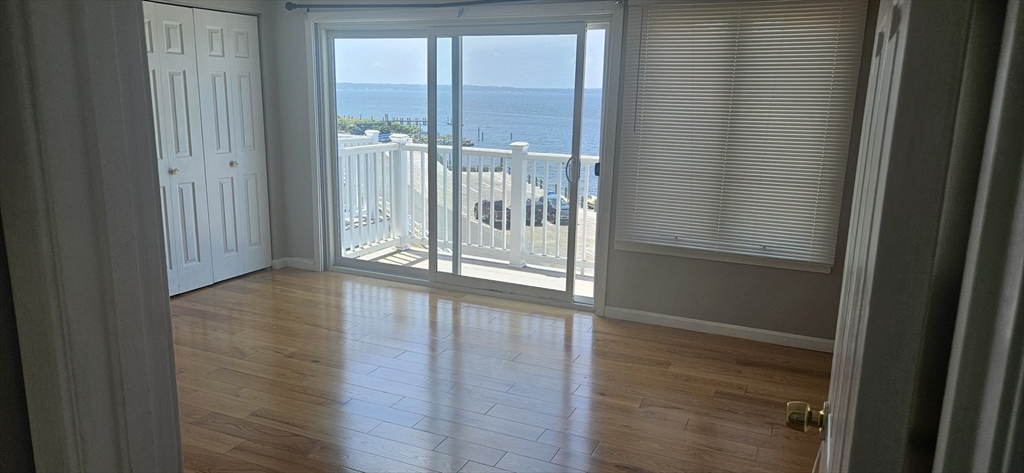 700 Shore Drive, Unit 513 Fall River, MA 02721 - Photo 10 of 12 a view of entryway with wooden floor