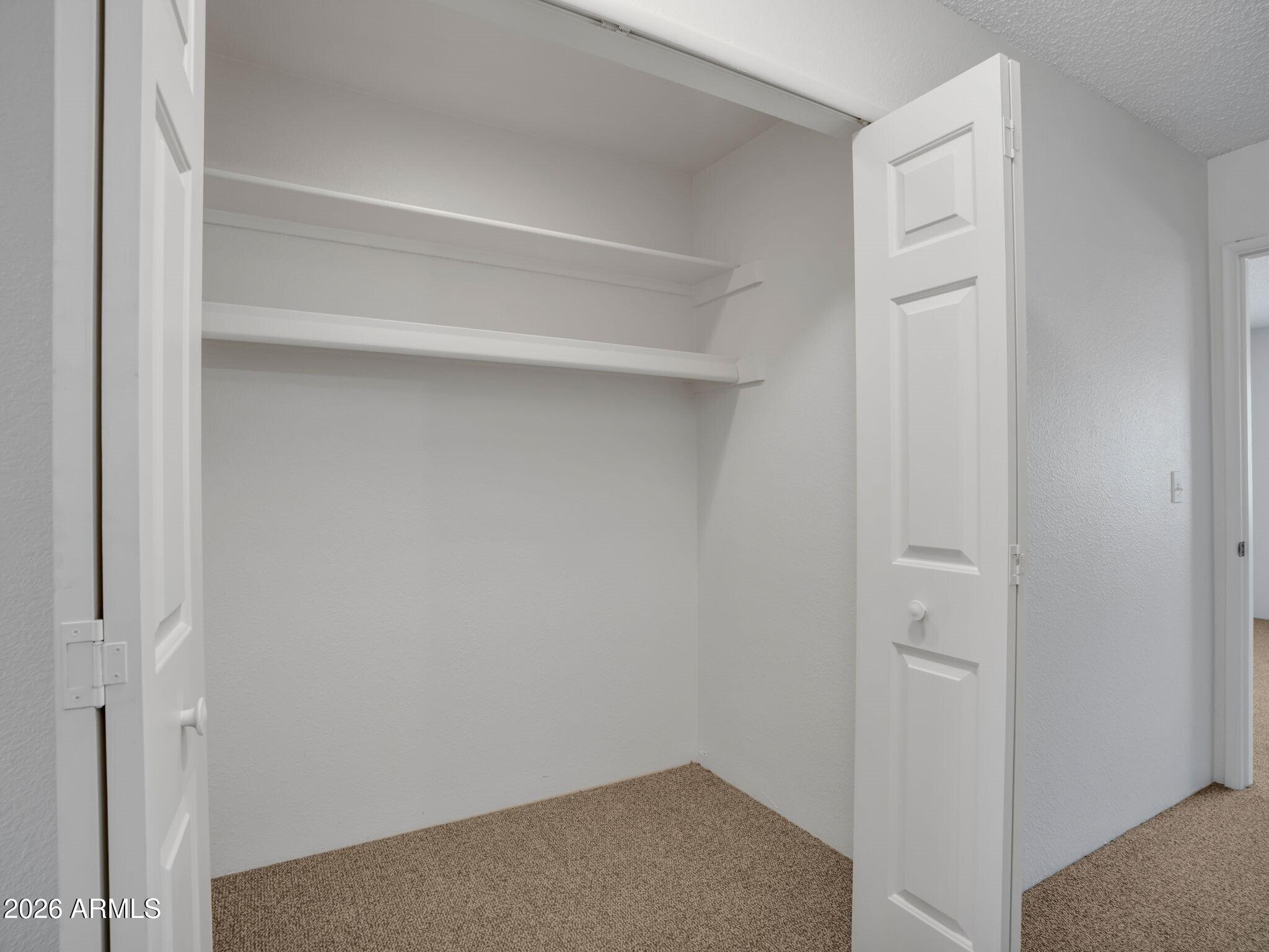 371 Rim Rock Circle, Unit 2 Prescott, AZ 86303 - Photo 20 of 36 021_2nd level hall storage