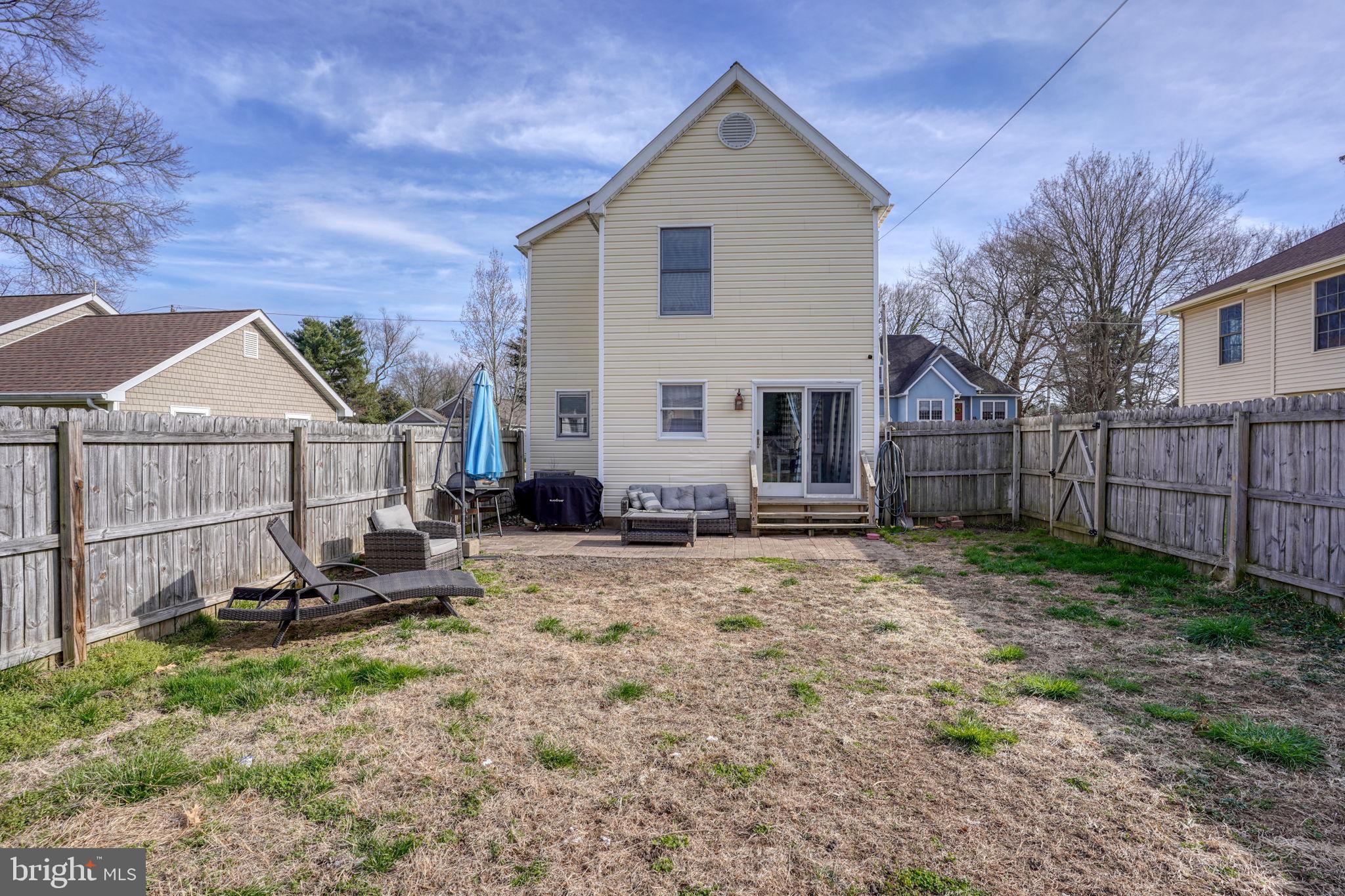 31 Washington Street Dover, DE 19901 - Photo 14 of 38 a view of backyard with wooden fence and a bench