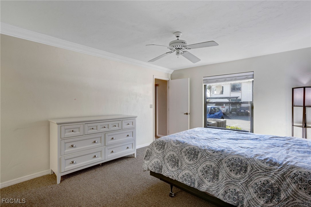 13256 Whitehaven Lane, Unit 501 Fort Myers, FL 33966 - Photo 14 of 28 a bedroom with a bed and a dresser