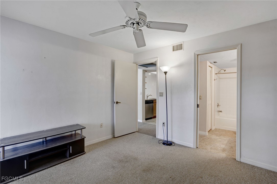 13256 Whitehaven Lane, Unit 501 Fort Myers, FL 33966 - Photo 17 of 28 a view of empty room with a ceiling fan