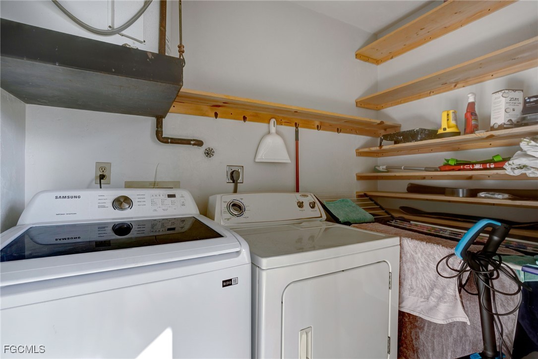 13256 Whitehaven Lane, Unit 501 Fort Myers, FL 33966 - Photo 24 of 28 a utility room with dryer and washer