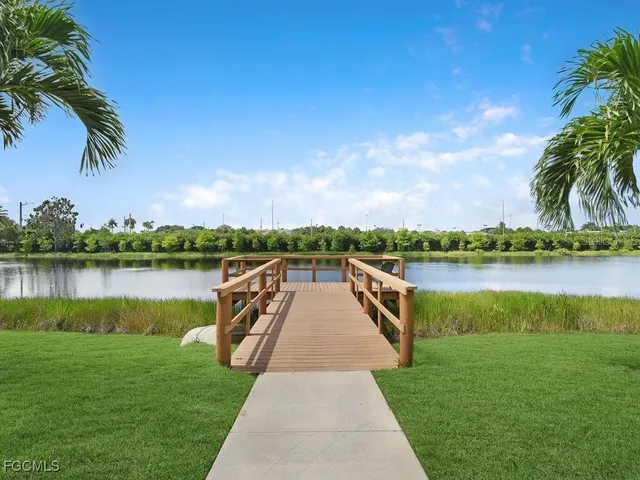 a view of a house with swimming pool and sitting area