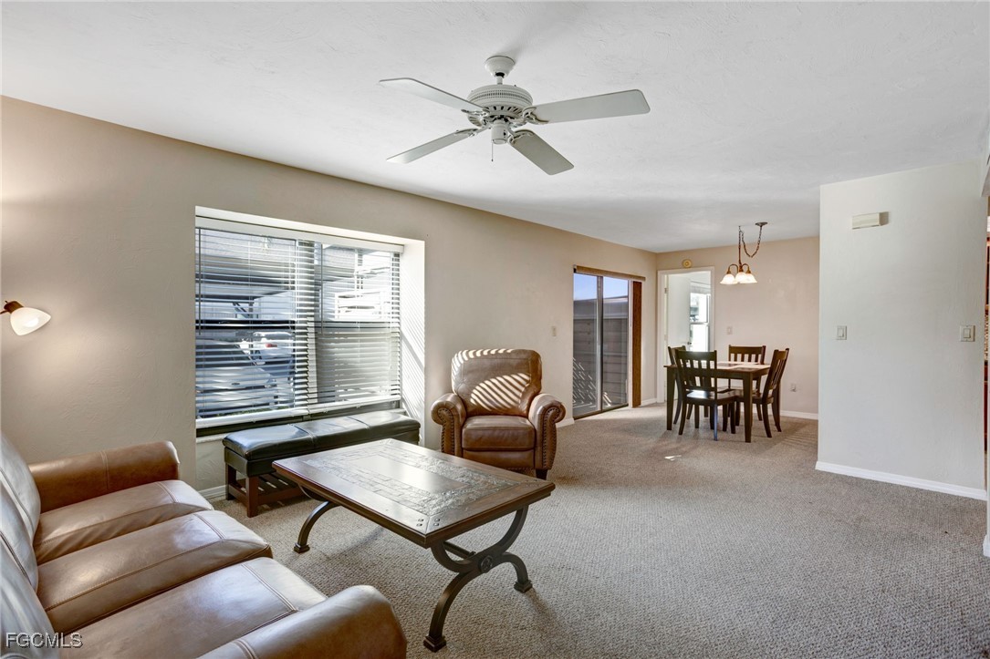 13256 Whitehaven Lane, Unit 501 Fort Myers, FL 33966 - Photo 10 of 28 a living room with furniture and a window