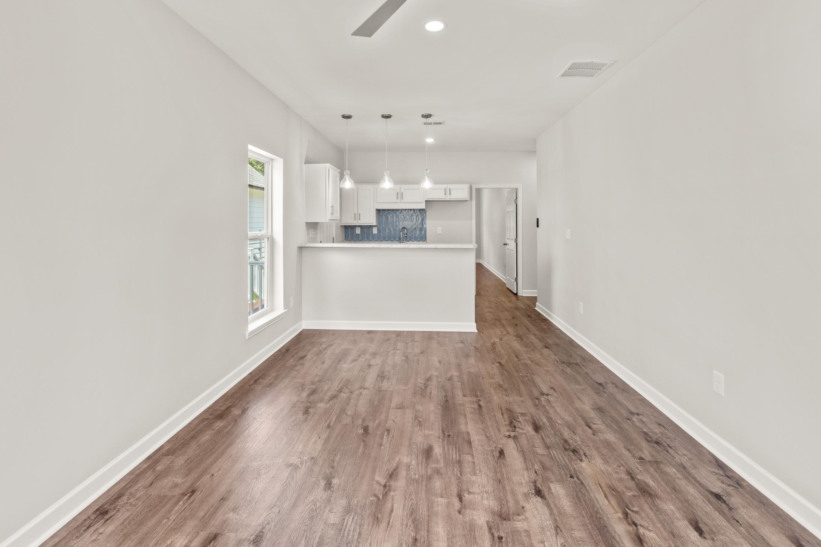 820 Semmes Street Memphis, TN 38111 - Photo 2 of 15 Unfurnished living room with recessed lighting, dark wood-style floors, and ceiling fan