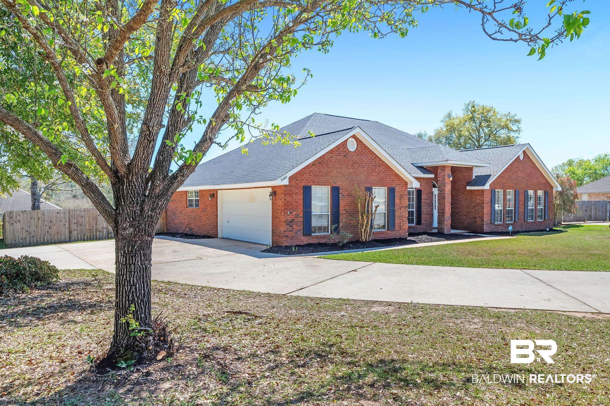 16444 Hamlet Lane Foley, AL 36535 - Photo 2 of 49 View of front of house featuring brick siding, fence, and concrete driveway