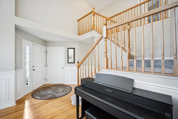 a livingroom with wooden floor and stairs