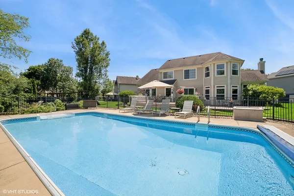 a view of swimming pool with seating area