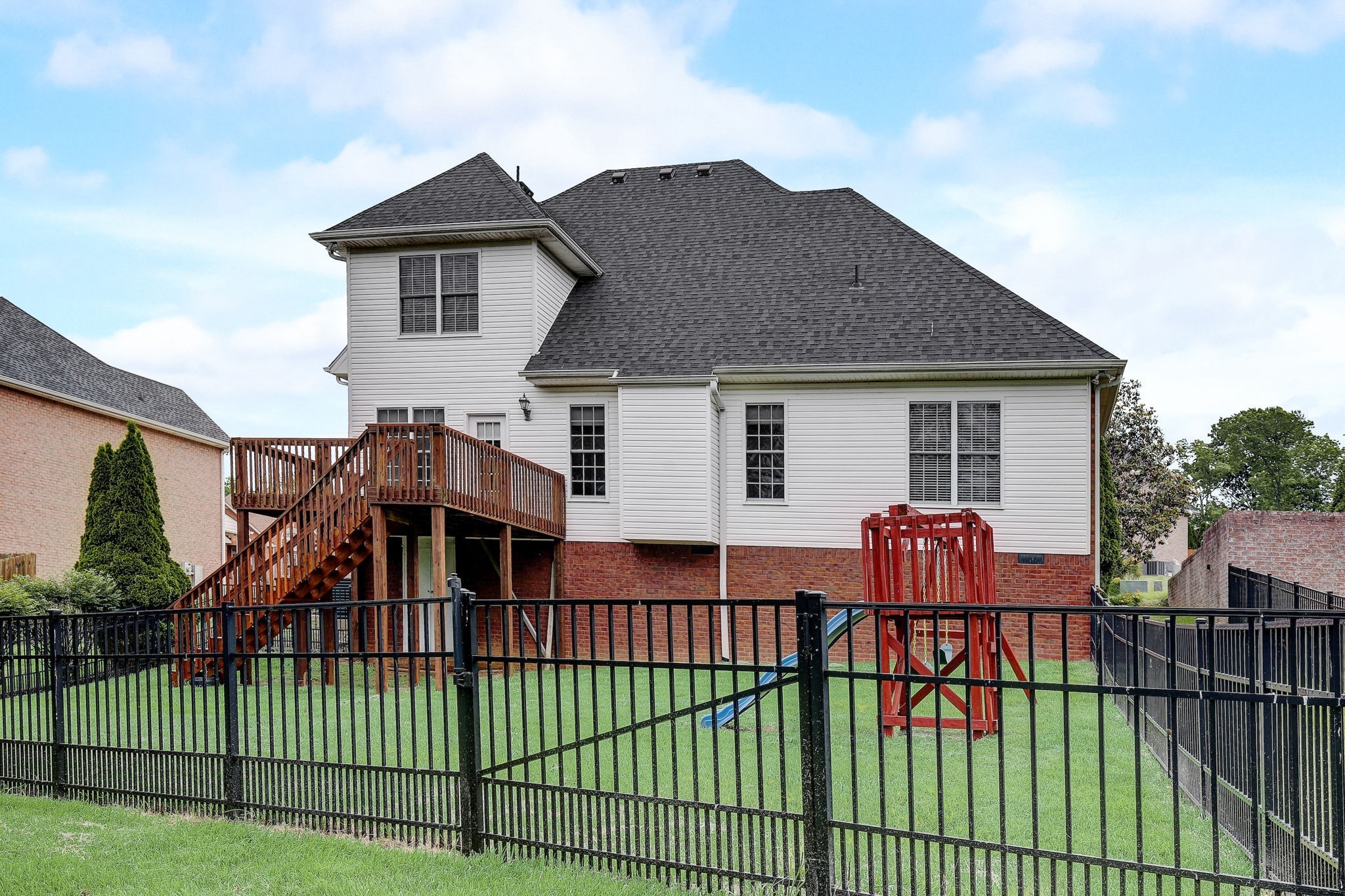 124 Cedar Ridge Lane Hendersonville, TN 37075 - Photo 2 of 66 a view of a house with a wooden deck and furniture