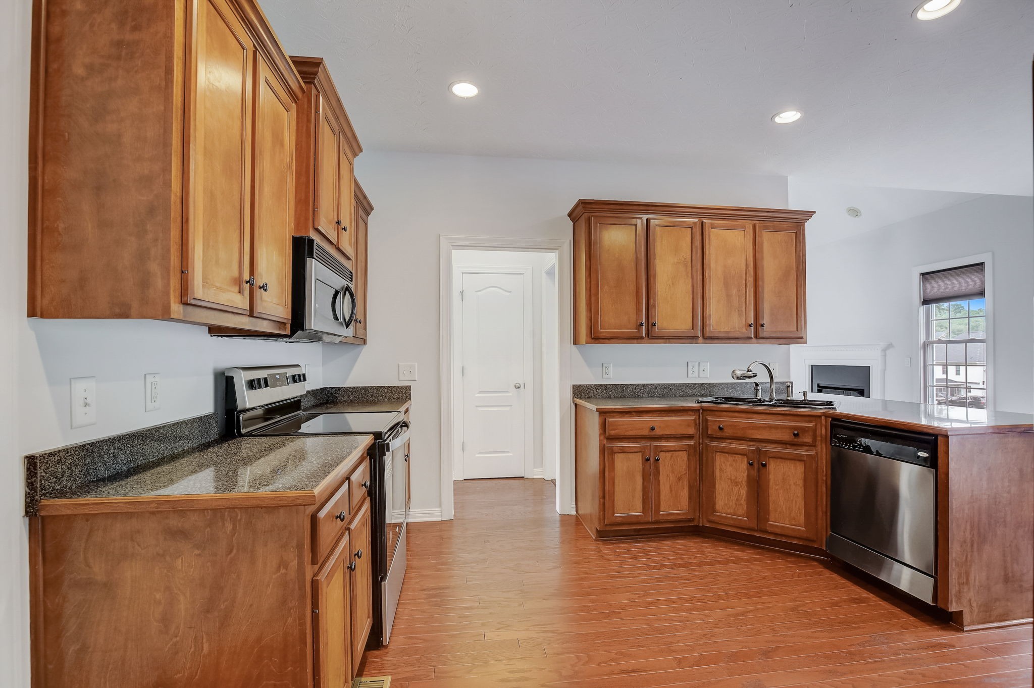 124 Cedar Ridge Lane Hendersonville, TN 37075 - Photo 5 of 66 a kitchen with stainless steel appliances granite countertop a stove a sink and a microwave