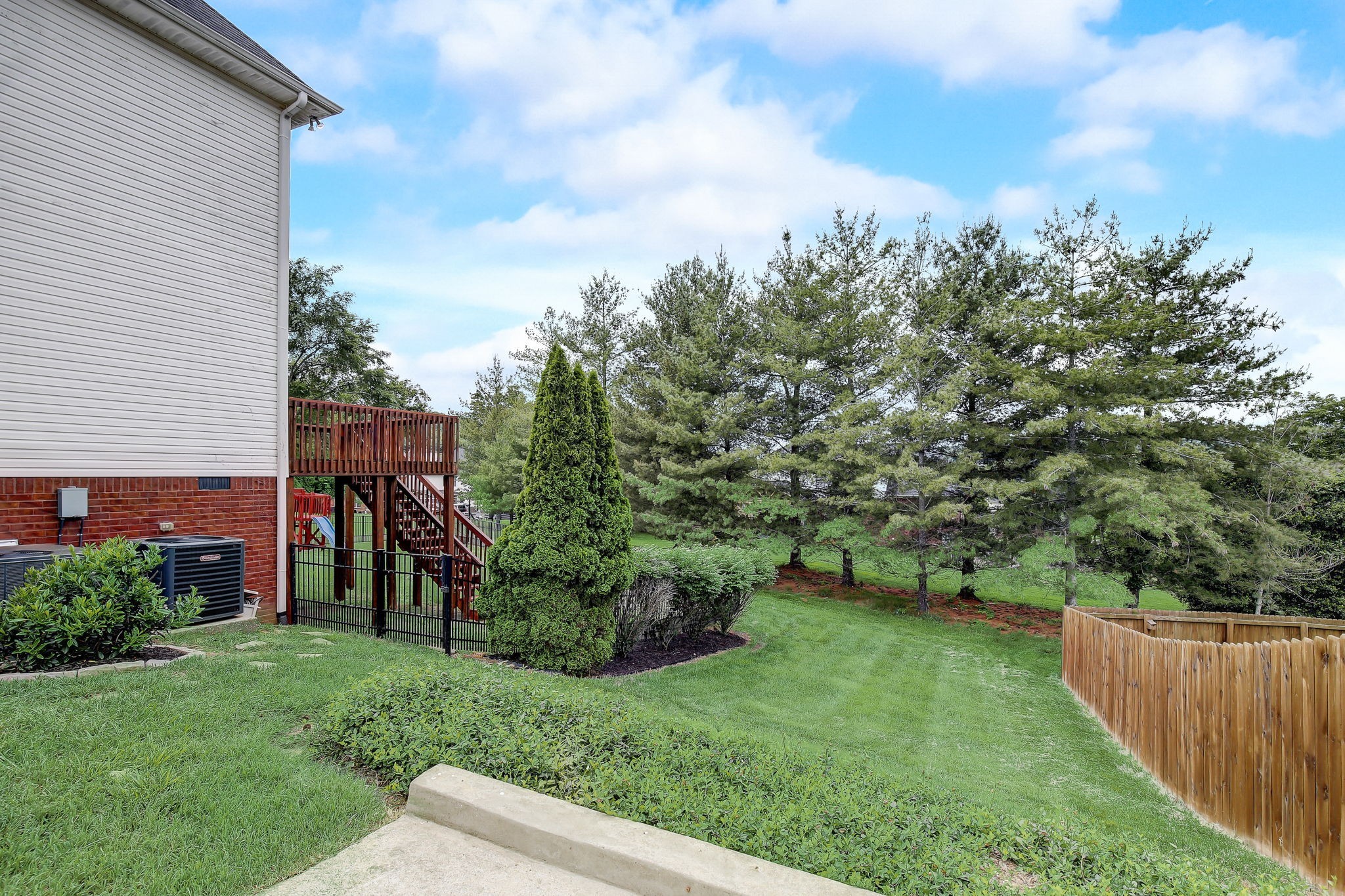 124 Cedar Ridge Lane Hendersonville, TN 37075 - Photo 52 of 66 a view of a backyard with potted plants and large tree