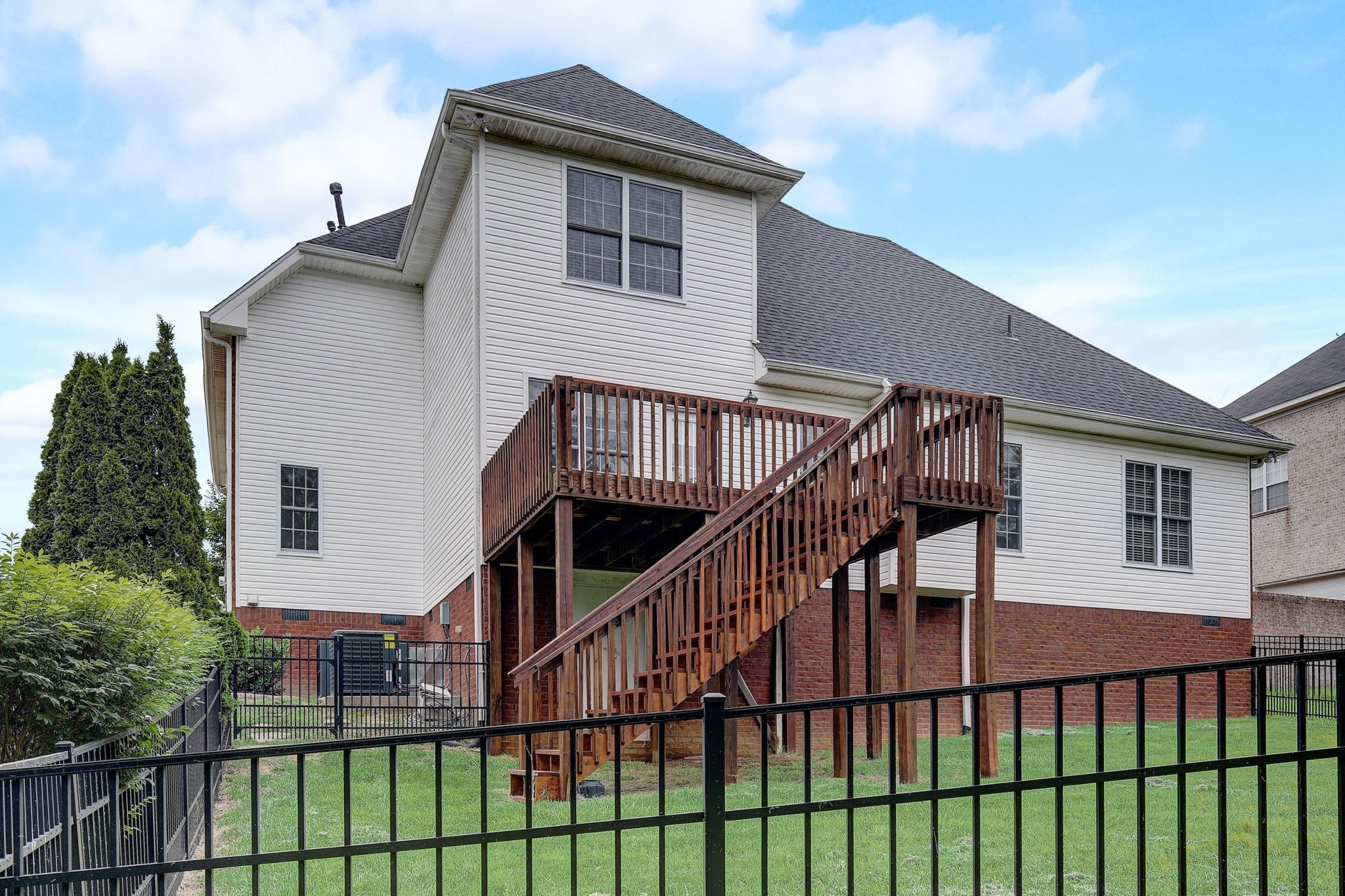 124 Cedar Ridge Lane Hendersonville, TN 37075 - Photo 53 of 66 a view of a house with large windows and a white roof