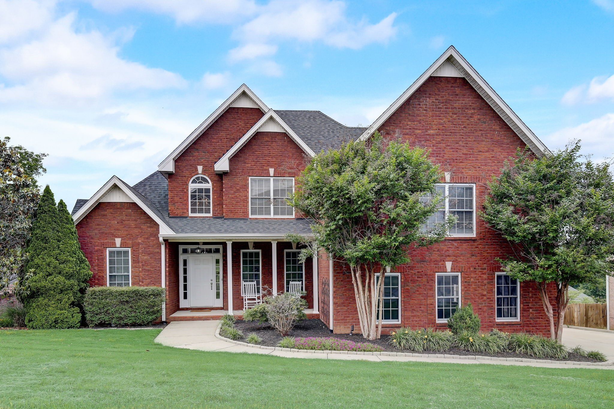124 Cedar Ridge Lane Hendersonville, TN 37075 - Photo 55 of 66 front view of brick house with a yard