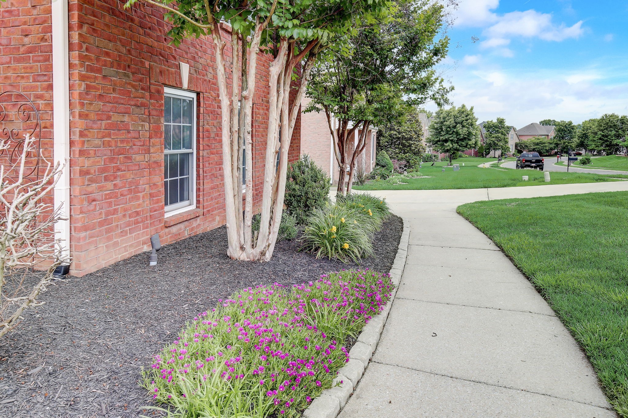 124 Cedar Ridge Lane Hendersonville, TN 37075 - Photo 56 of 66 a front view of a house with a yard and potted plants