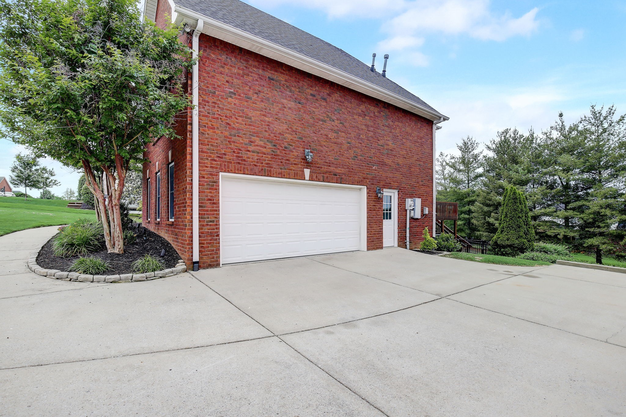 124 Cedar Ridge Lane Hendersonville, TN 37075 - Photo 57 of 66 a front view of a house with a yard and garage