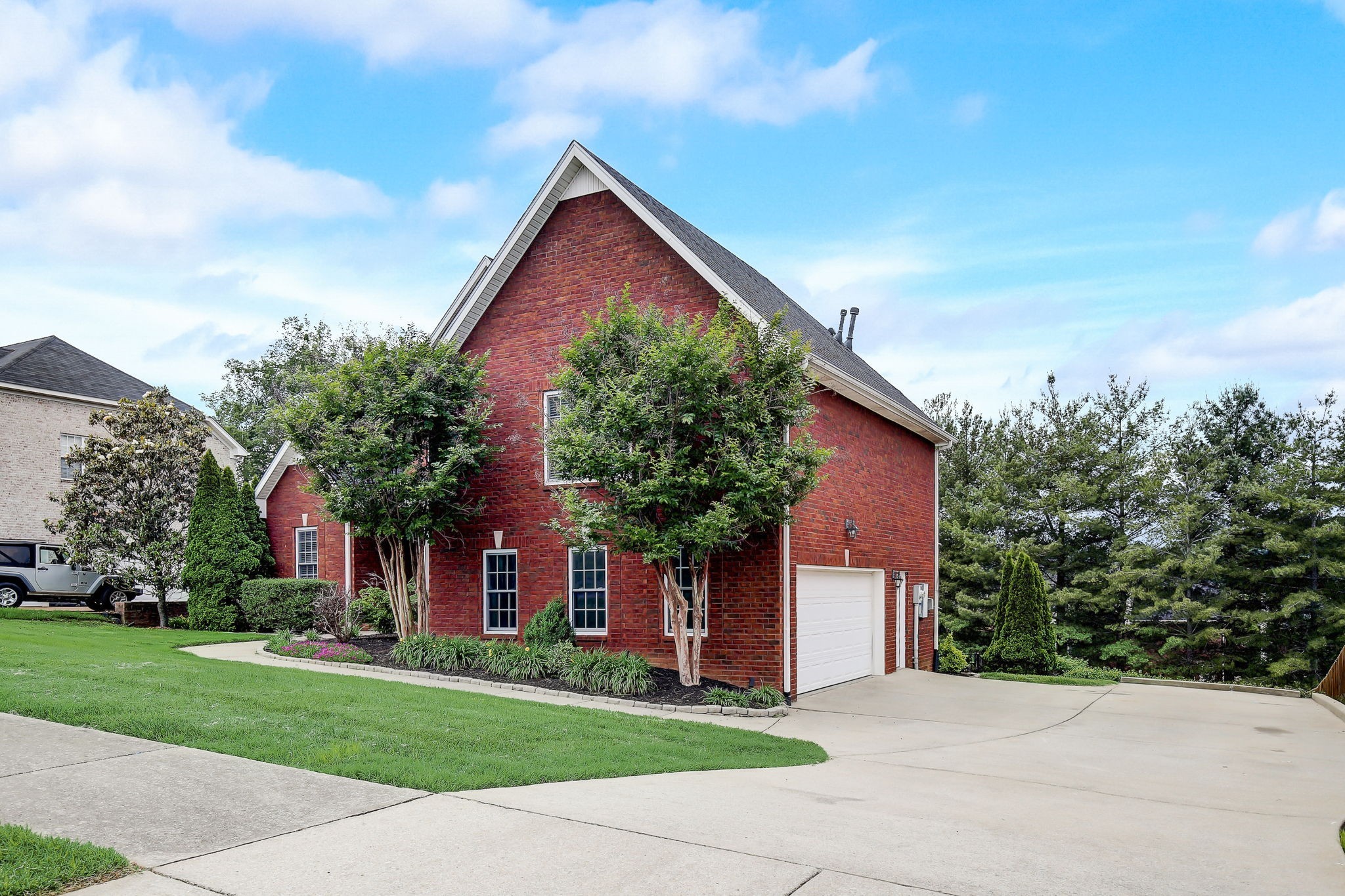 124 Cedar Ridge Lane Hendersonville, TN 37075 - Photo 58 of 66 front view of house with a yard and trees