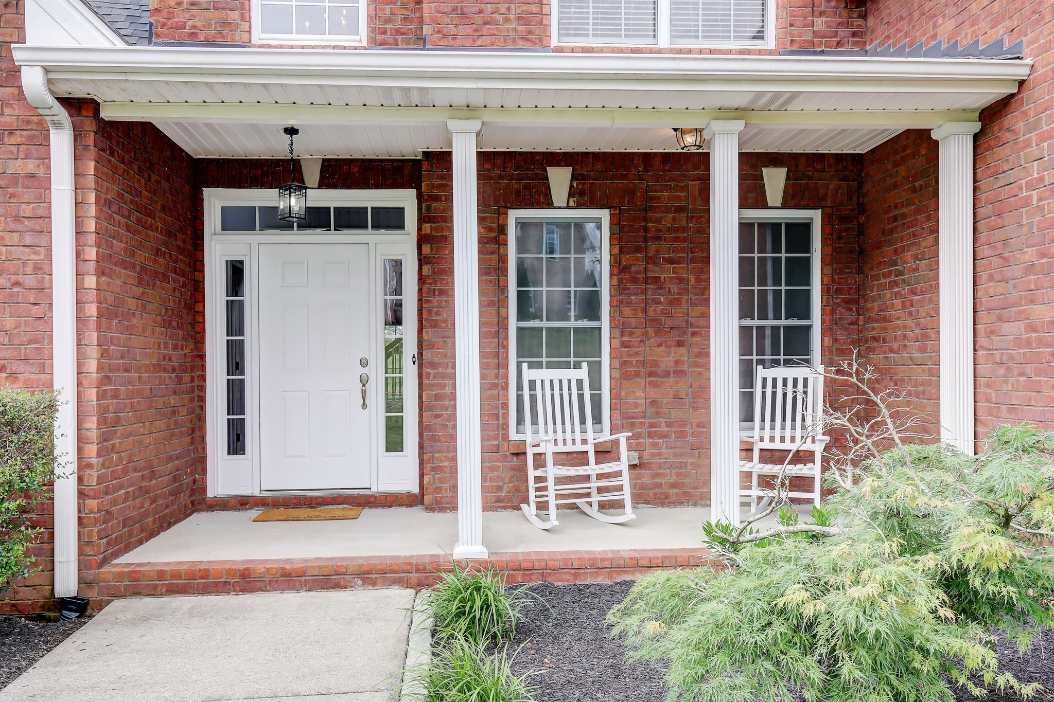 124 Cedar Ridge Lane Hendersonville, TN 37075 - Photo 59 of 66 a front view of a building with a garden