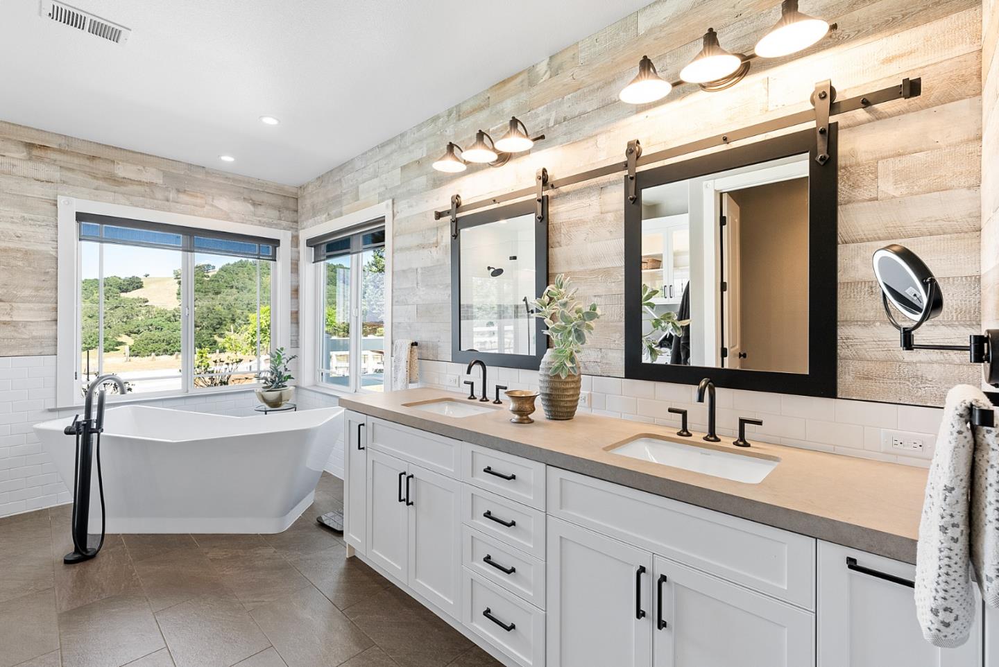 4460 Roop Road Gilroy, CA 95020 - Photo 25 of 68 a bathroom with a double vanity sink bathtub and next to a window