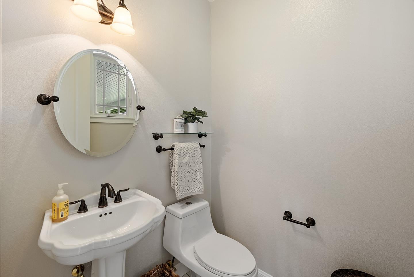 4460 Roop Road Gilroy, CA 95020 - Photo 32 of 68 a bathroom with a sink mirror and toilet