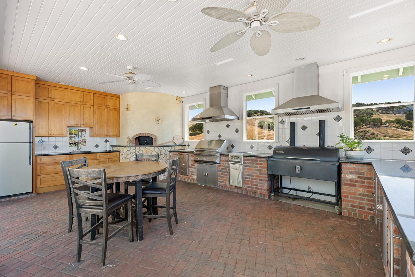 4460 Roop Road Gilroy, CA 95020 - Photo 35 of 68 a dining hall with stainless steel appliances kitchen island granite countertop furniture and a kitchen view