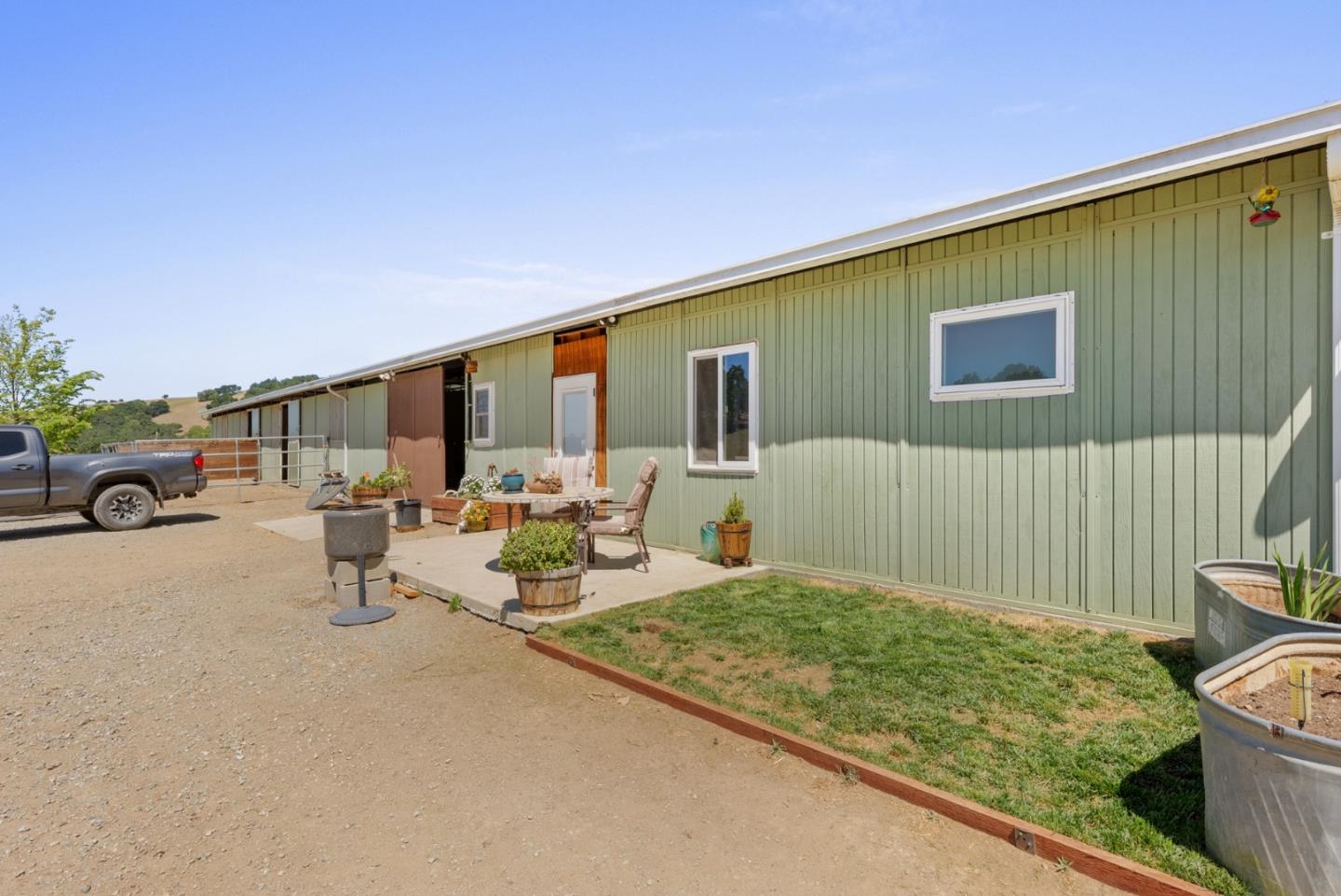 4460 Roop Road Gilroy, CA 95020 - Photo 45 of 68 a backyard of a house with outdoor seating
