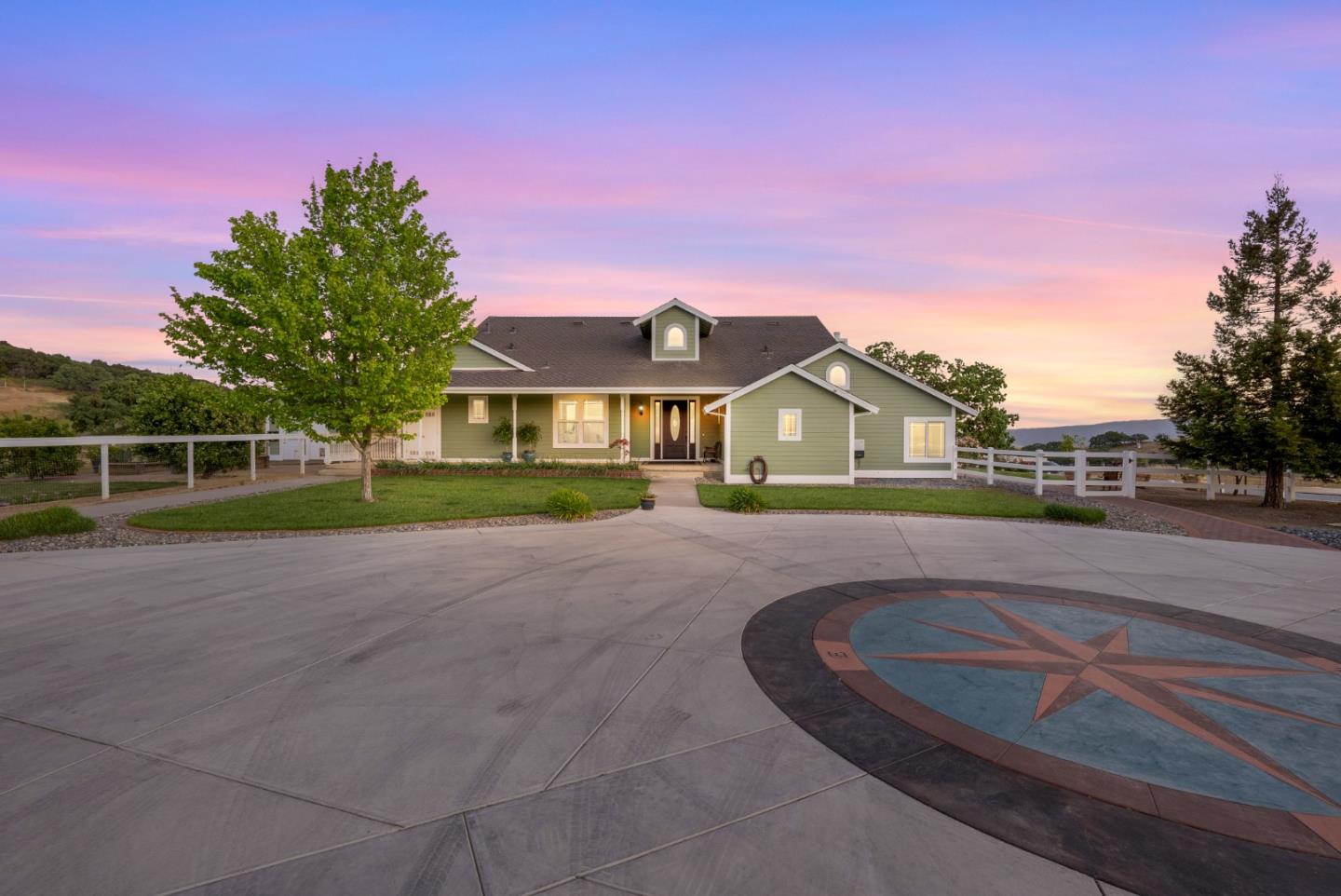 4460 Roop Road Gilroy, CA 95020 - Photo 7 of 68 a front view of a house with a yard and garage